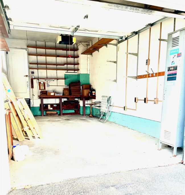 Garage with a garage door opener | Image 46