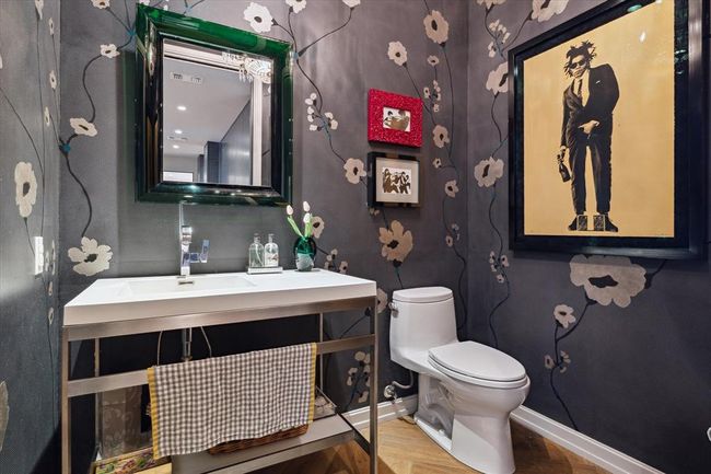 Hand-painted walls in this powder bath were a custom commission by the seller, creating a sophisticated yet whimsical space. Thoughtfully designed with elegant fixtures and curated artwork, this one-of-a-kind room makes a bold, stylish statement. | Image 23