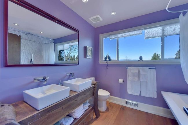 Bathroom with wood finished floors, double vanity, recessed lighting, and curtained shower | Image 29