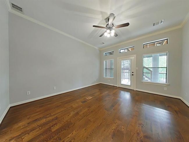 Spacious downstairs primary bedroom with direct porch access. | Image 18