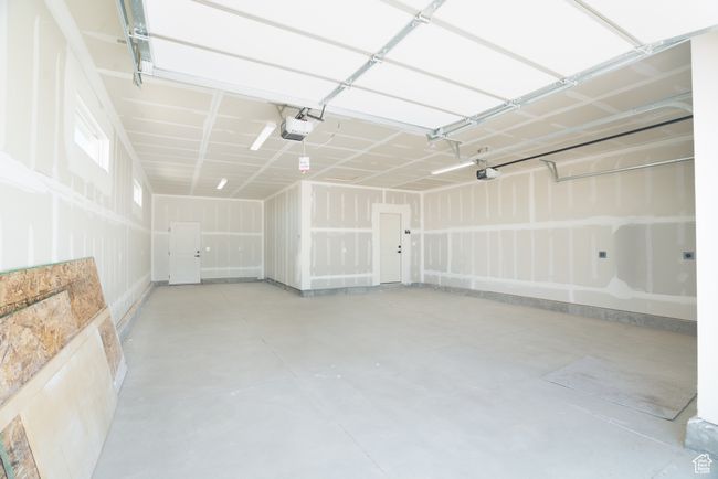 Garage with a garage door opener | Image 23