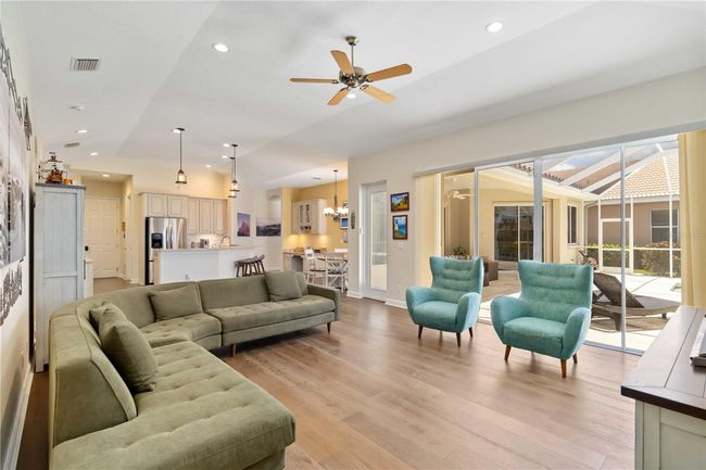 Combined kitchen and family room over looking pool. | Image 12