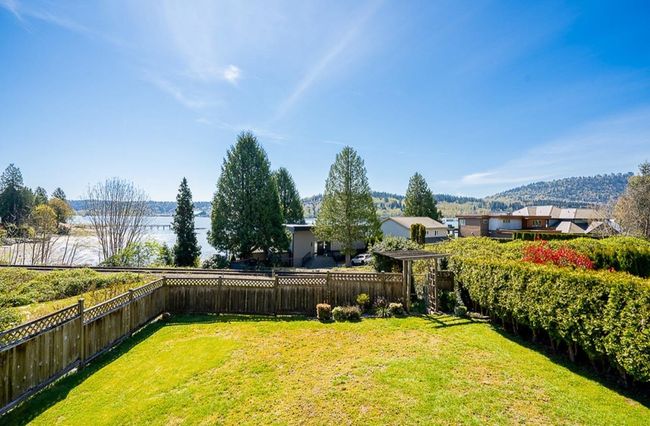 Fenced backyard with a mountain view | Image 34