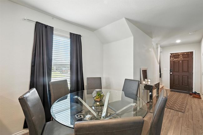 Dining area featuring wood finished floors and recessed lighting | Image 8