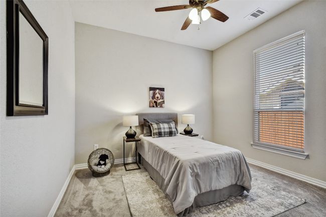 The guest bedrooms are both nice and spacious, featuring their own walk-in closets. | Image 16