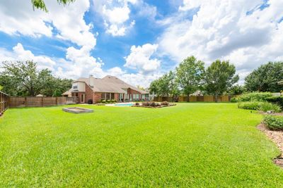 The backyard sets this home apart from others...pool & spa; removable child fencing; playset; storage shed (not shown); raised garden bed waiting for your favorite herbs; plus yard left for a game of soccer or volley ball! | Image 2