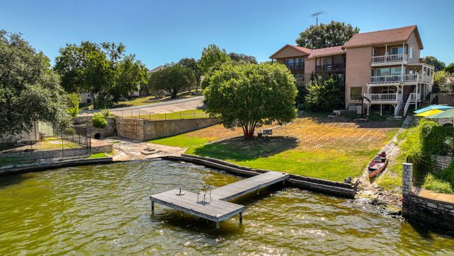 View of dock with a balcony, a lawn, and a water view | Image 35