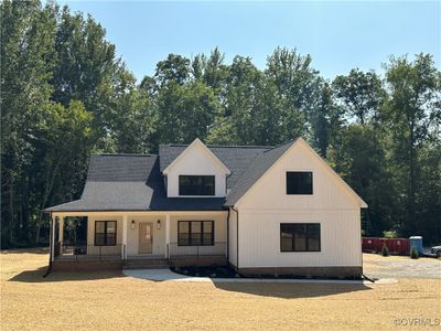 Modern inspired farmhouse with a porch | Image 2