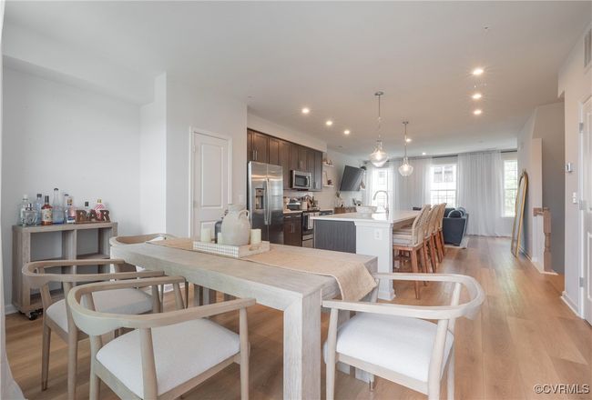 Dining room with recessed lighting and light wood-style flooring | Image 18