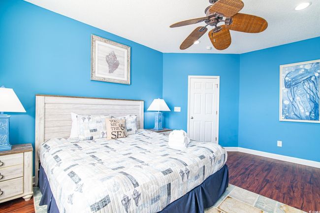Bedroom with wood finished floors, baseboards, recessed lighting, and ceiling fan | Image 30