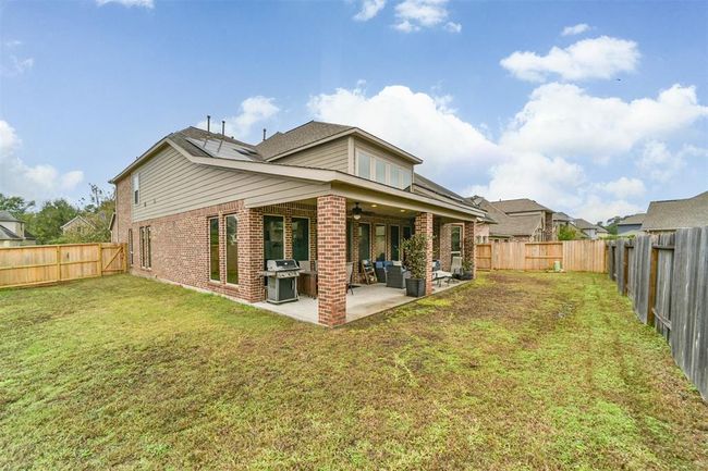 The oversized lot provides ample space for pets and children to play. Large enough for a future pool if you so choose. Notice the energy savings solar panels. Purchased and owned by the seller. No lease to assume. | Image 20