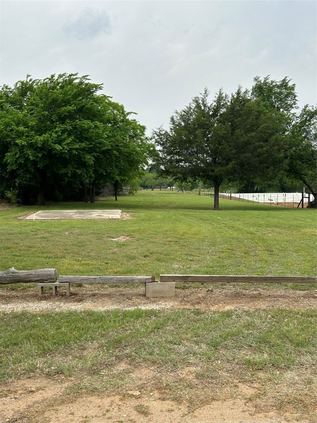 View of community featuring a lawn and fence | Image 14
