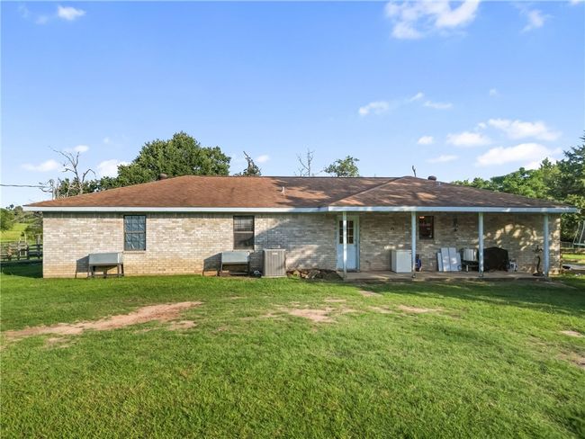 Back of property featuring brick siding and a yard | Image 31