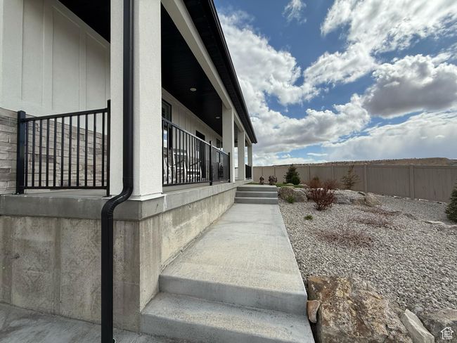 View of side of home with fence | Image 5