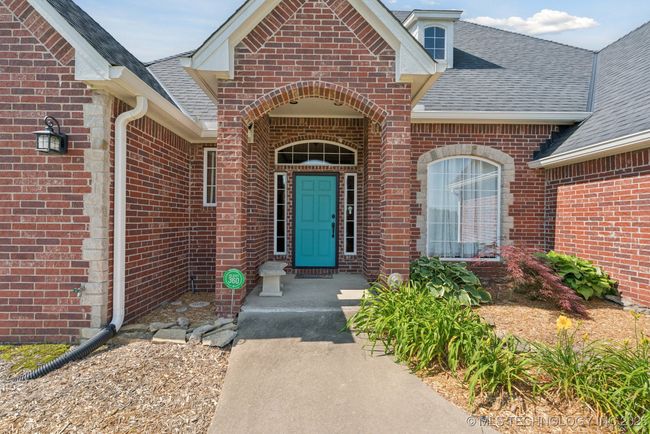 Beautiful covered front porch and landscaping with sprinkler system. | Image 4