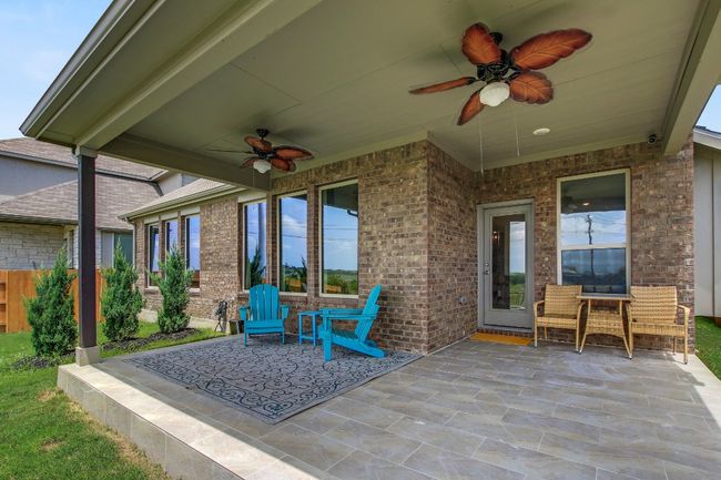 View of patio / terrace featuring ceiling fan | Image 32