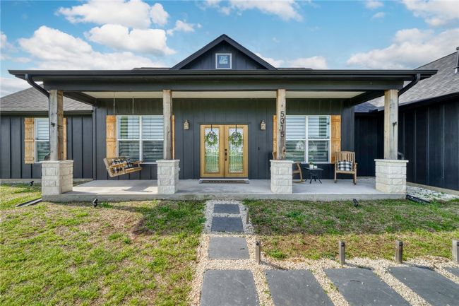 View of exterior entry with a lawn and french doors | Image 5