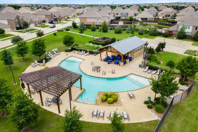 Community pool with a residential view and a patio | Image 24