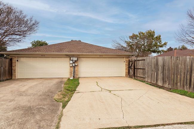 Garage featuring concrete driveway | Image 23