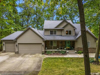 7111 Tucker Road, Home with 4 bedrooms, 3 bathrooms and null parking in Groveland Twp MI | Image 2