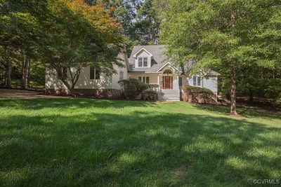 Front of the house set back from the street. Lush lawn. Mature Trees. | Image 2