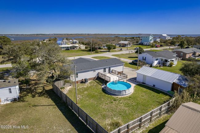 Partially fenced backyard | Image 36