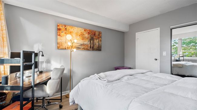 Full wall of closets adorn this room with mirrors | Image 20
