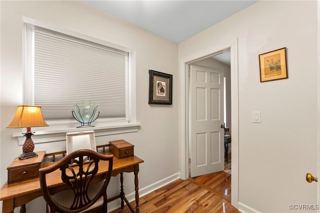 Home office featuring baseboards and light wood-style floors | Image 36