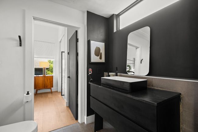 Bathroom featuring vanity and wood finished floors | Image 23