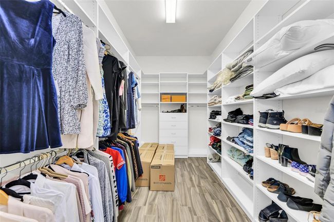 walk-in closet in primary bedroom | Image 37