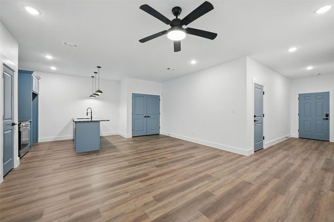Unfurnished living room featuring recessed lighting, a ceiling fan, and wood finished floors | Image 14
