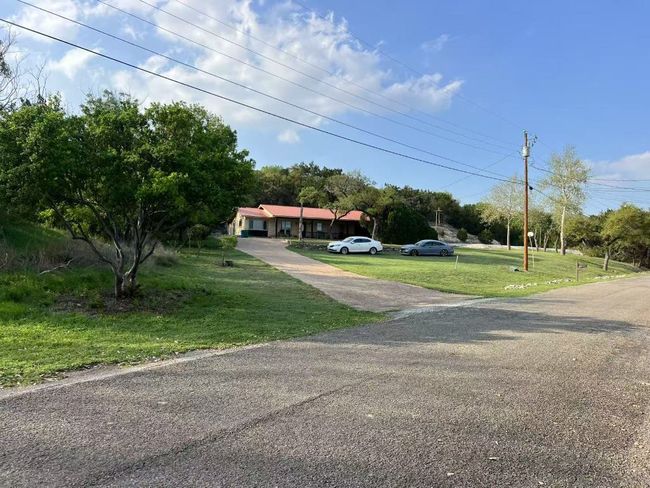 Neighbor's house on a large lot. | Image 16