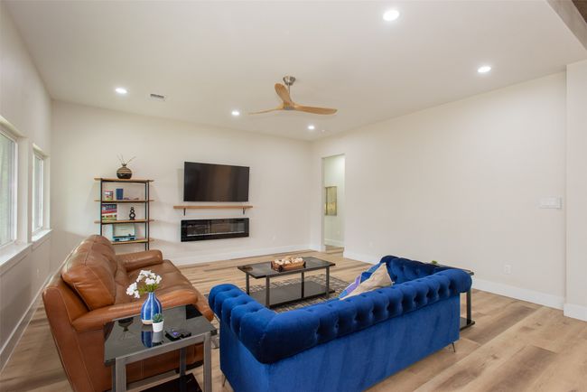 Living room with ceiling fan and light hardwood / wood-style floors | Image 16