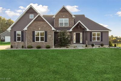 Craftsman house with a front yard and a garage | Image 2