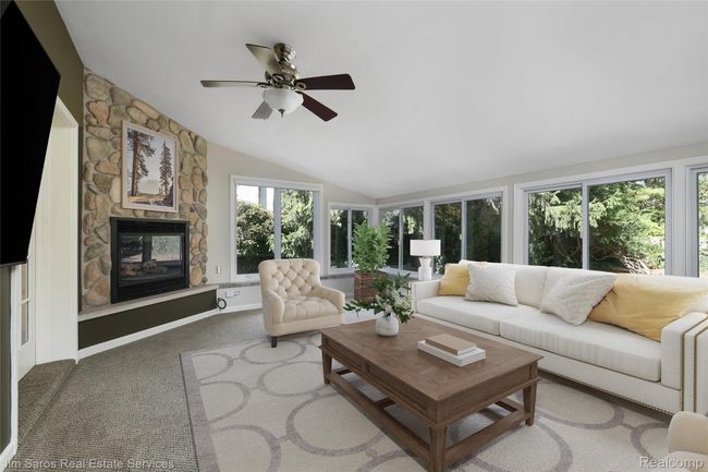 Sunroom featuring vaulted ceiling and carpet | Image 7