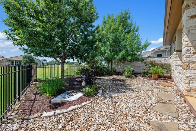View of fenced backyard | Image 27