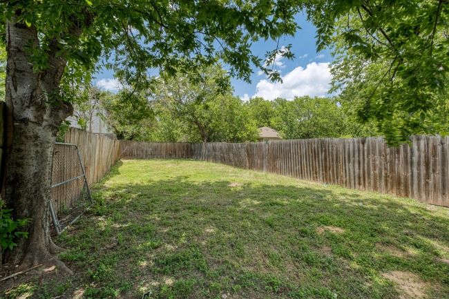 View of fenced backyard | Image 22