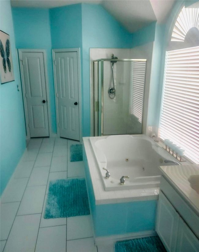 Full bath with Walk-In shower, jetted garden tub, beautiful tile floors, vanity and plenty of storage. | Image 26