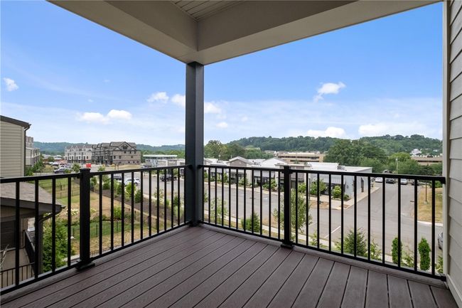 Owner's Suite private covered deck with low maintenance flooring and railing. | Image 22