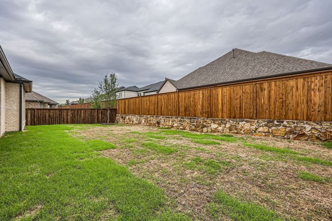 View of yard with a fenced backyard | Image 27