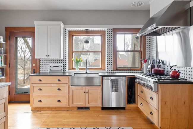 A barbeque deck and access to the front yard is located right off the kitchen. | Image 24