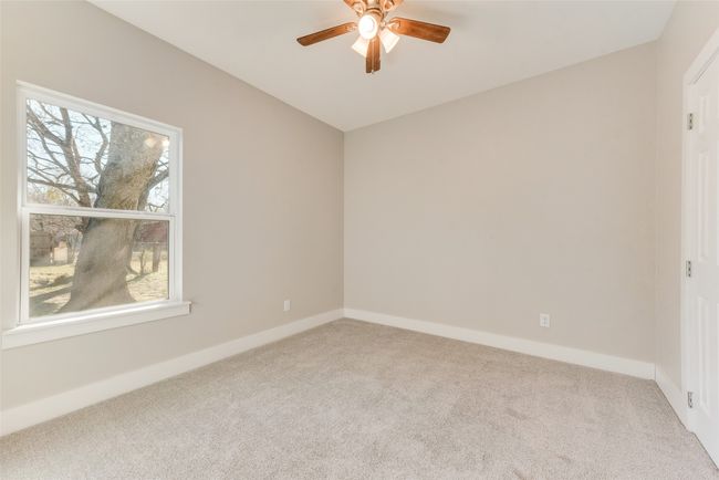 Unfurnished room featuring carpet and a ceiling fan | Image 20