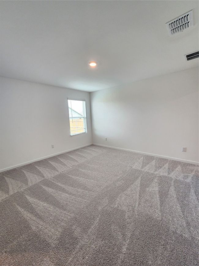 Carpeted spare room featuring baseboards and recessed lighting | Image 11
