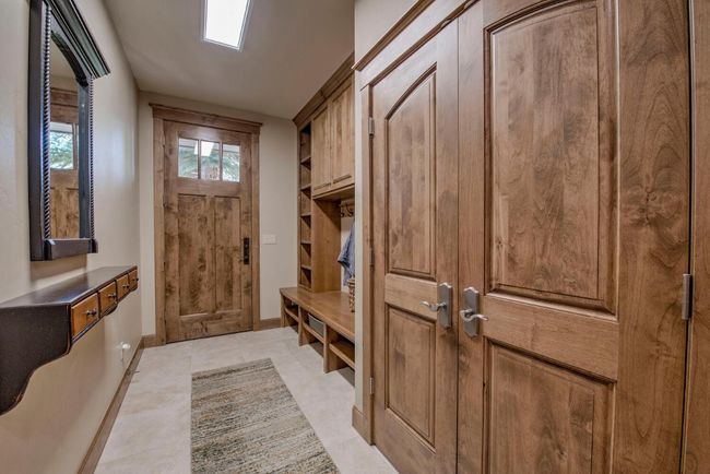 Secondary entry on the front of the house with mud room and built-in storage. | Image 41