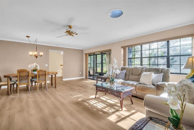 Brand NEW luxury vinyl flooring, beautiful crown molding & immediate green conservation views~ | Image 6
