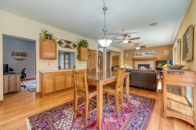 Built in buffet is located between informal dining and flex room | Image 16