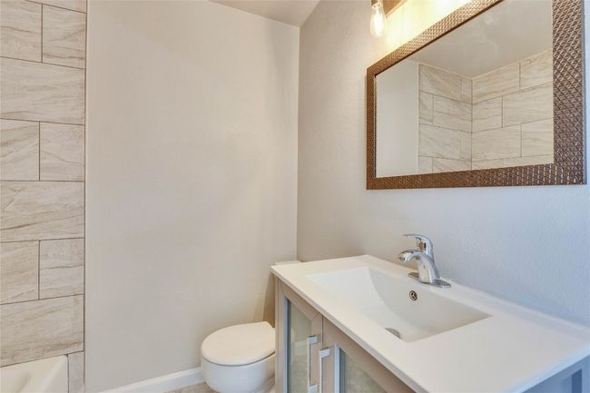 Primary Bathroom attached to primary bedroom with updated shower, light fixtures and vanity. | Image 20