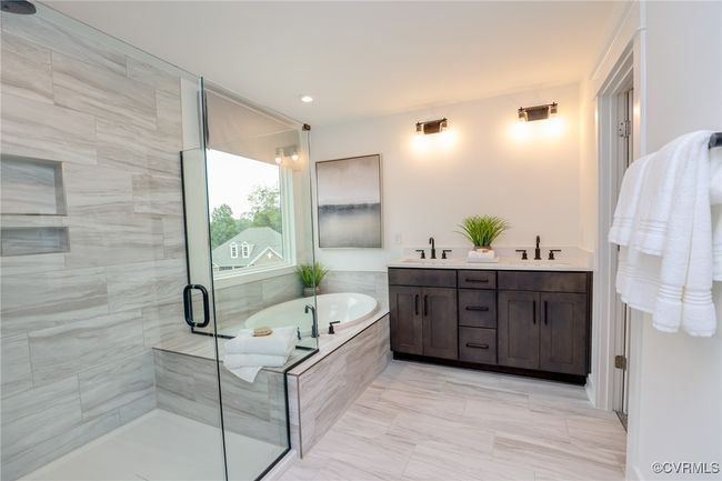 VIRTUAL STAGING. Photo represents the plan with virtual staging. Luxurious primary suite. | Image 20