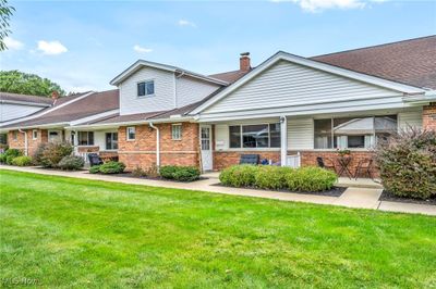 View of front of home featuring a front yard and a porch | Image 1