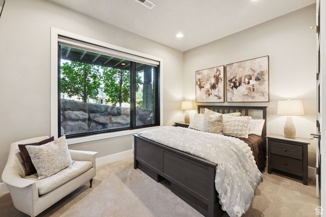 Bedroom featuring light colored carpet and recessed lighting | Image 17